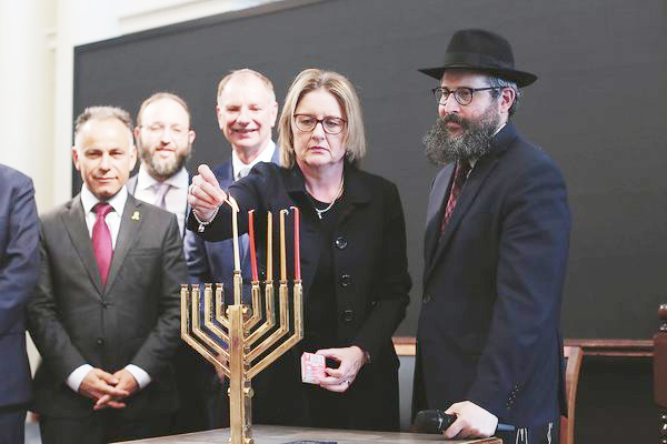 After synagogue arson.. Jewish community celebrates Hanukkah